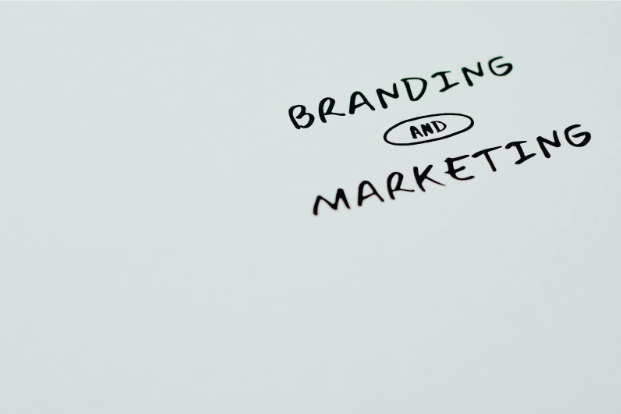 The words branding and marketing are written on a whiteboard